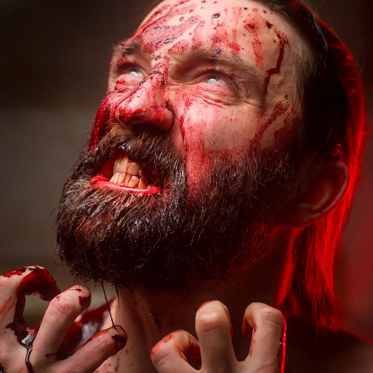 A man with bloodied face portraying a horror theme for Halloween.