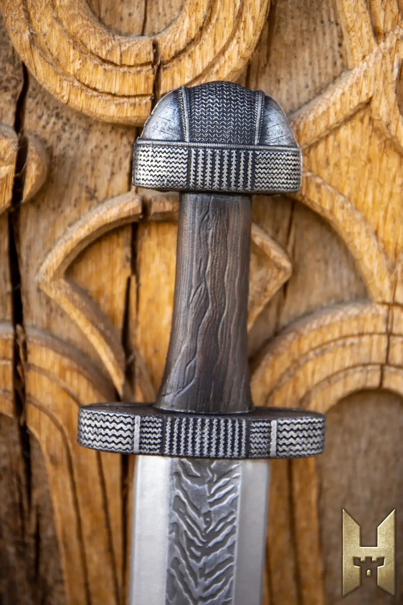 Close-up of a Viking sword hilt, showcasing intricate designs and craftsmanship, embodying Viking Swords heritage.