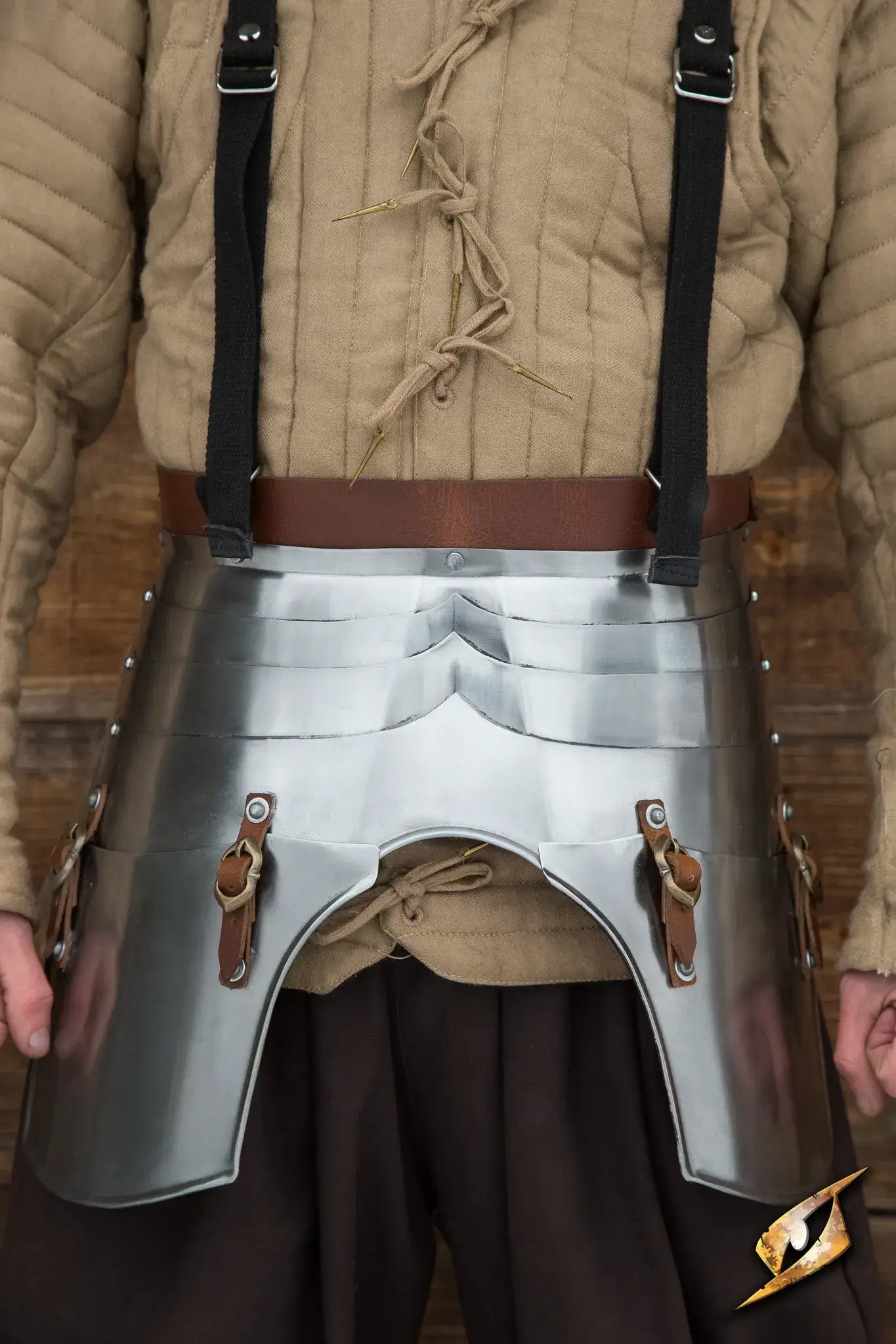 Faulds and Tassets showcasing polished plate armor providing waist and thigh protection.