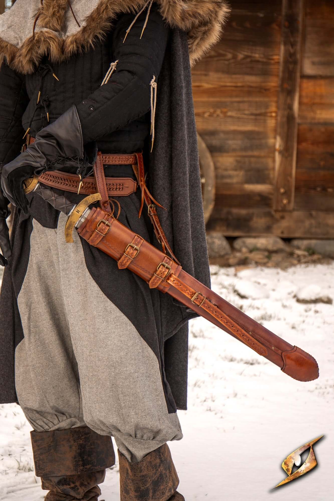 Scabbards & Sword Sheaths: A warrior displays a beautifully crafted brown leather scabbard.