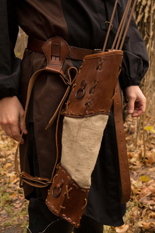 Brown leather and cloth quiver worn on hip, showcasing a historical design for archers.