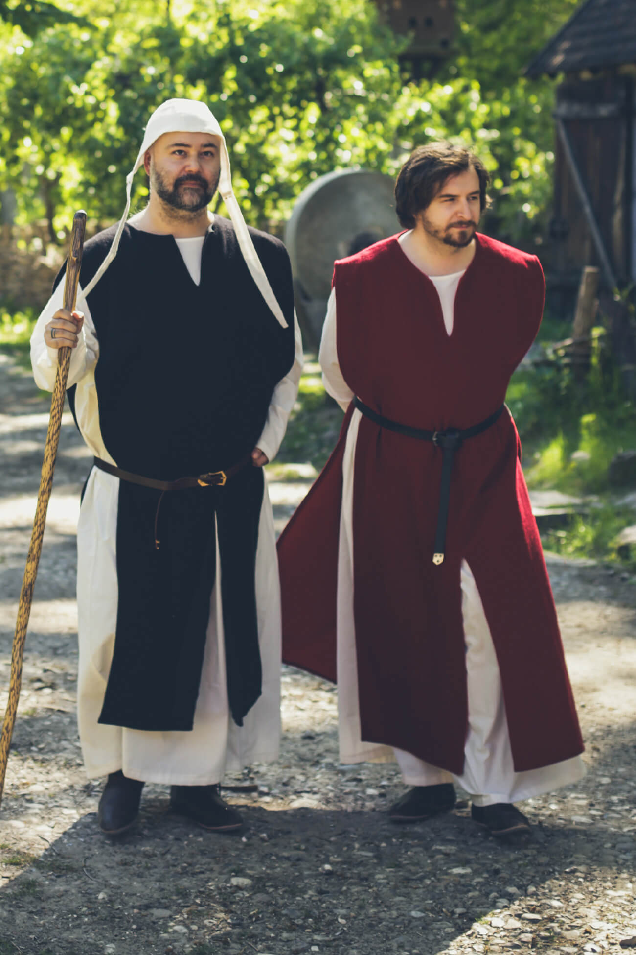 two men dressed in high medieval clothing
