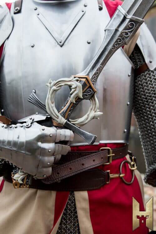 Stronghold foam sword held by armored knight, showcasing lightweight and stylish design for LARP combat.