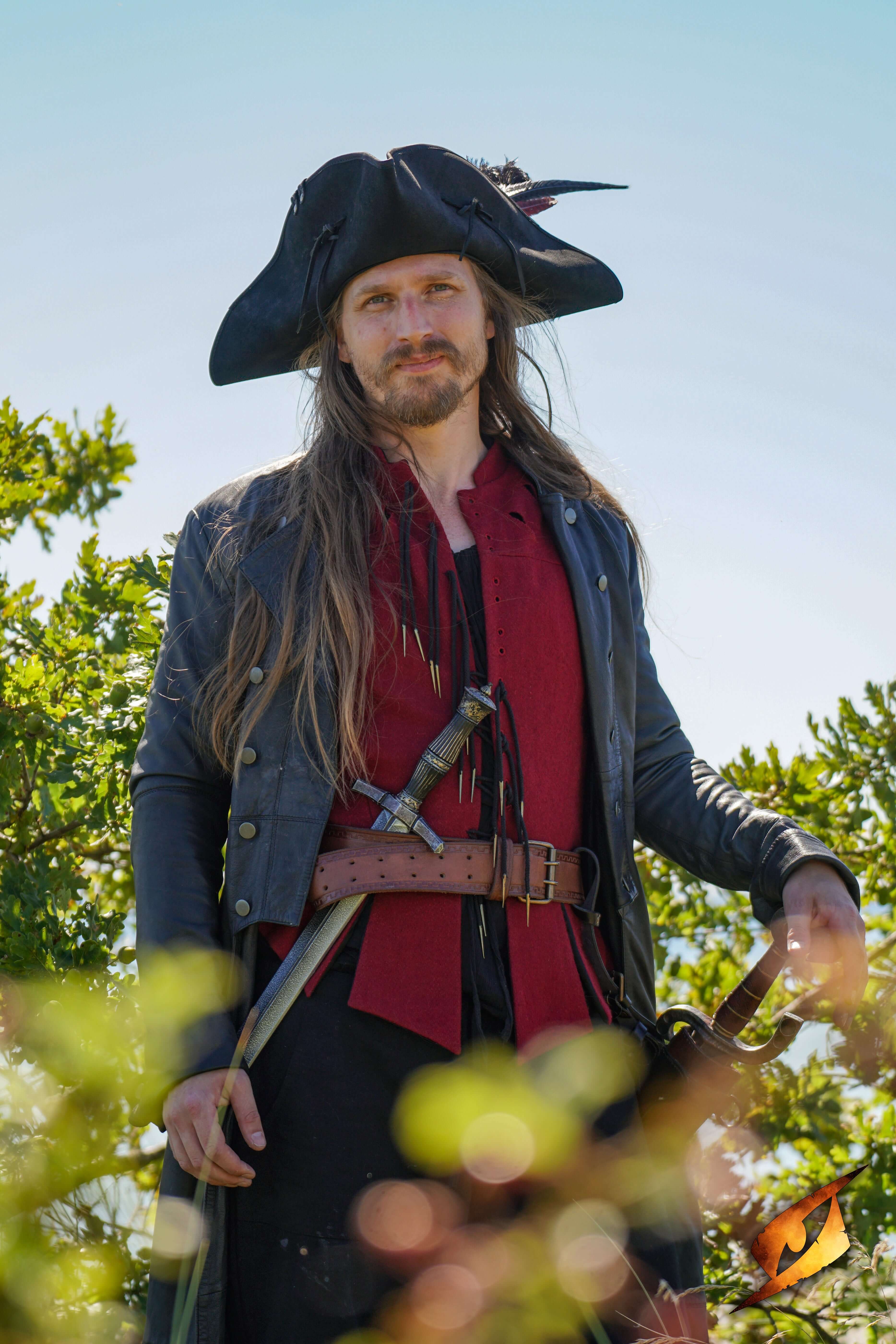 Pirate character wearing a hat and leather jacket, holding a sword in a green outdoor setting.
