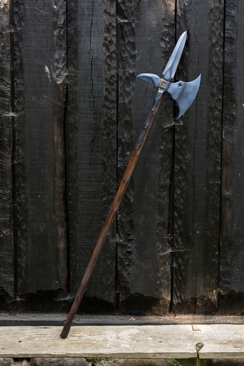 An ornate staff featuring a dual-headed axe blade, emblematic of the Staffs & Spears collection.