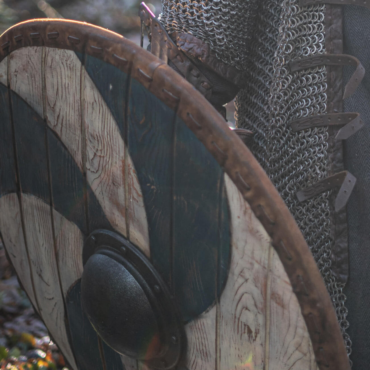 Close-up of a Viking shield with a blue and white design, symbolizing Viking Shields and Norse culture.