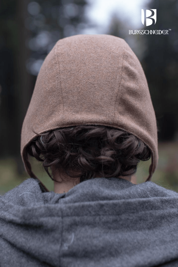 Wolfram Bundling Hood by Burgschneider showcasing the back view on a model in outdoor setting.