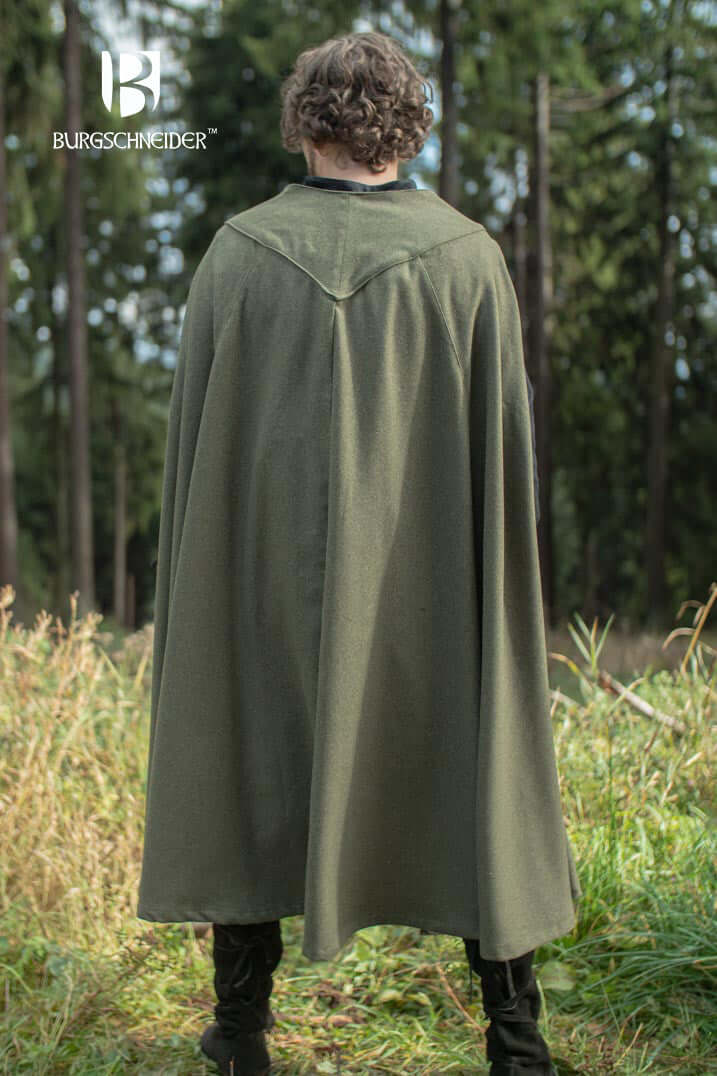 Cape Justus worn in nature, showcasing its elegant design and warmth for ranger-themed outfits.