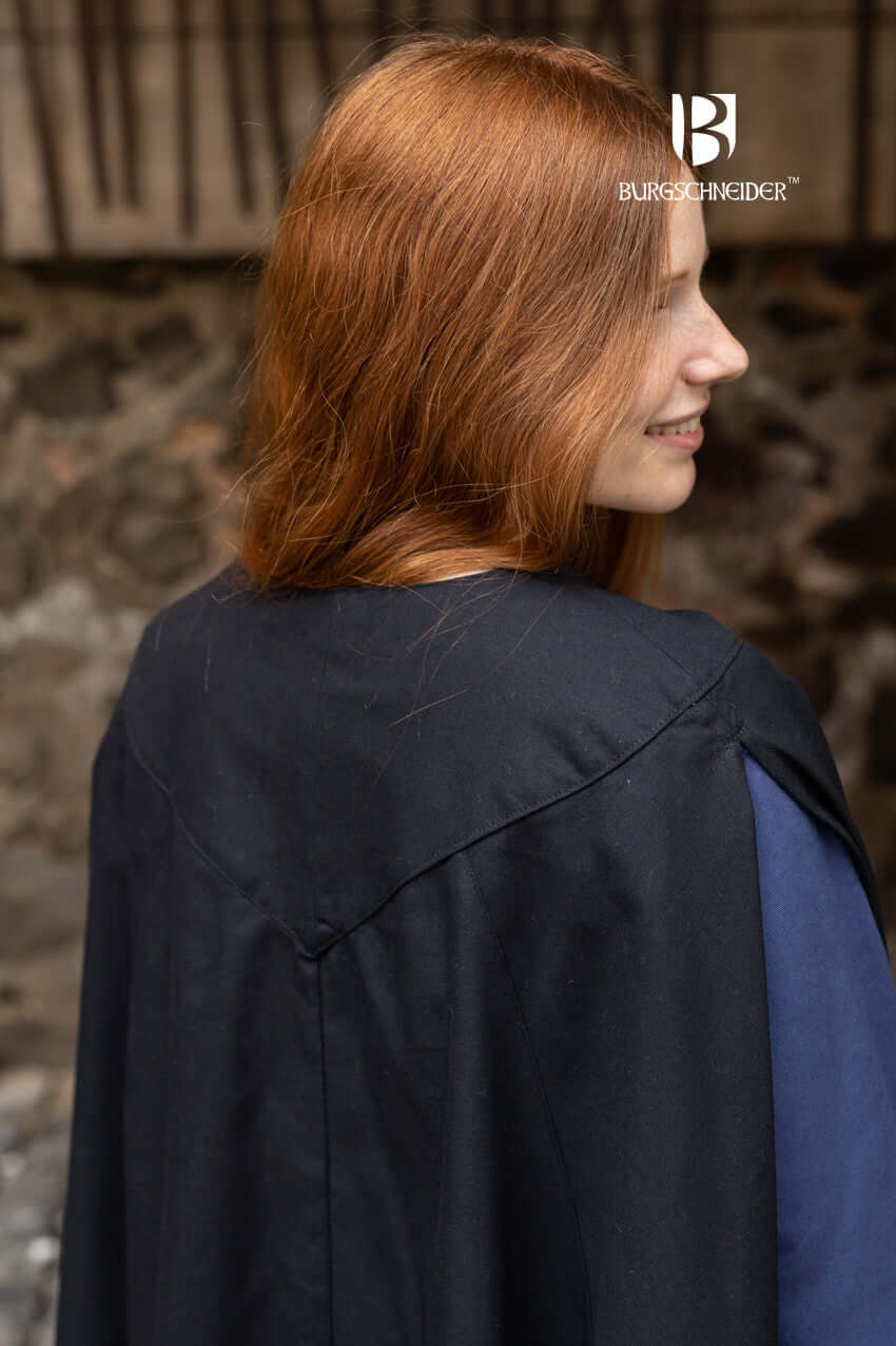 Cape Morpheus by Burgschneider, showcasing the elegant back design on a model with red hair.