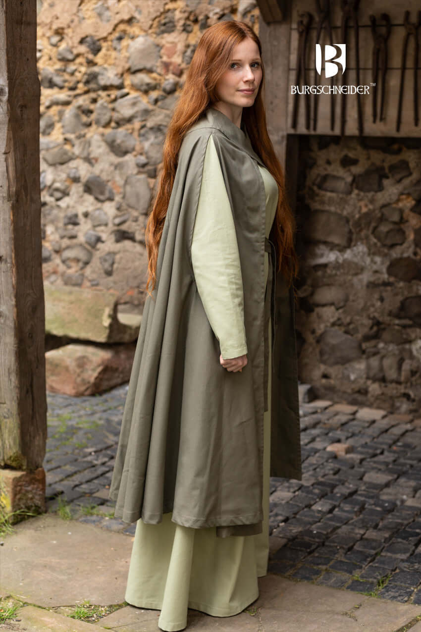 Model wearing the Cape Morpheus by Burgschneider, showcasing its stylish design and lighter cotton material.