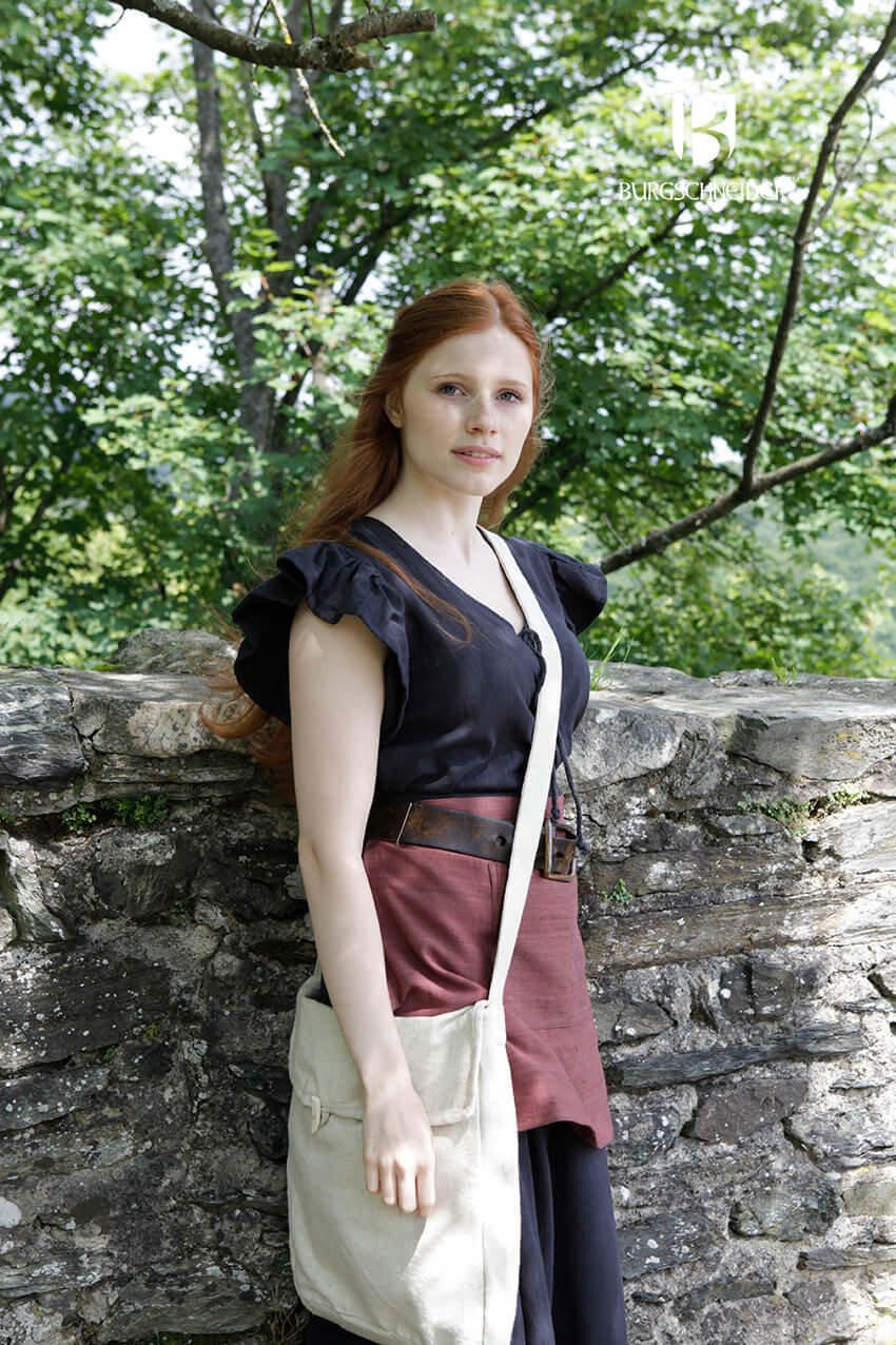Bag Ehwaz worn by a model in medieval attire against a natural backdrop.