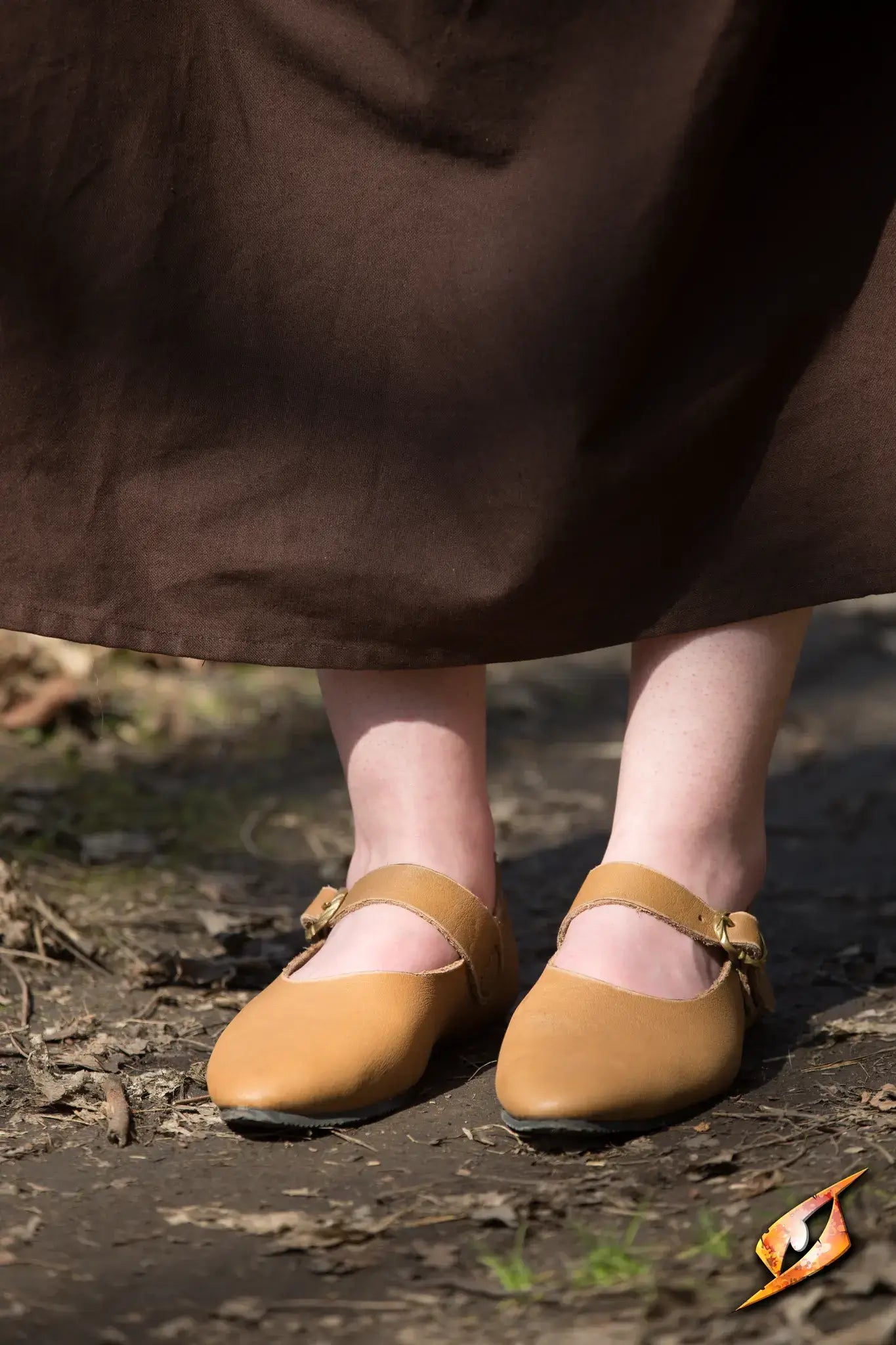 Shoes Astrid classic leather shoes worn by a woman on a path, showcasing their comfortable design and elegant style.
