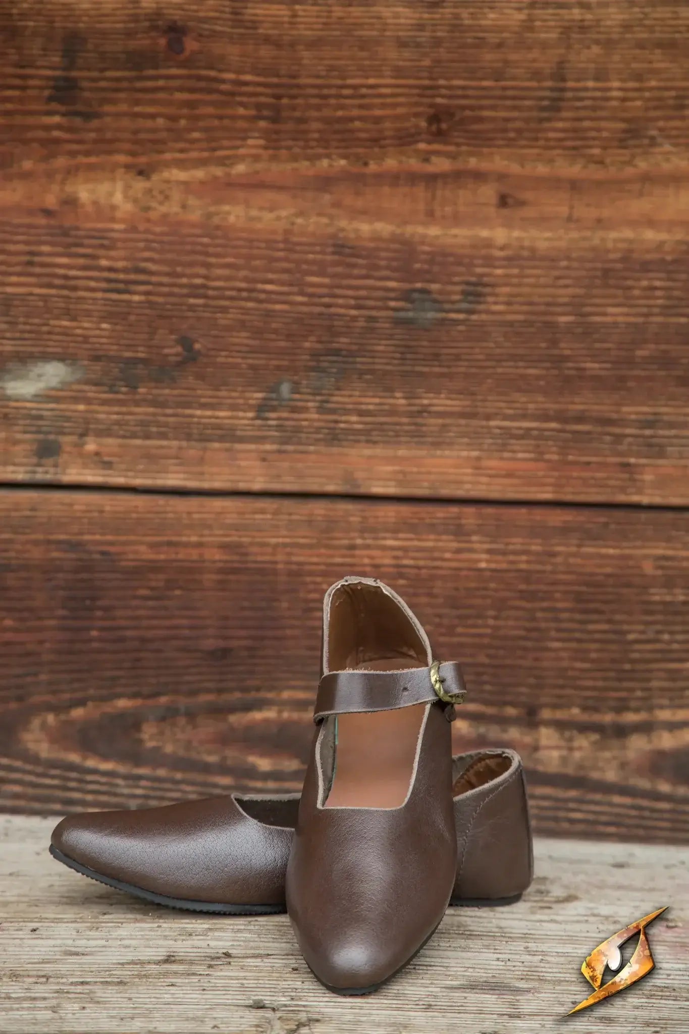 Brown Shoes Astrid with a single leather strap on wooden background, ideal for ladies and merchants.