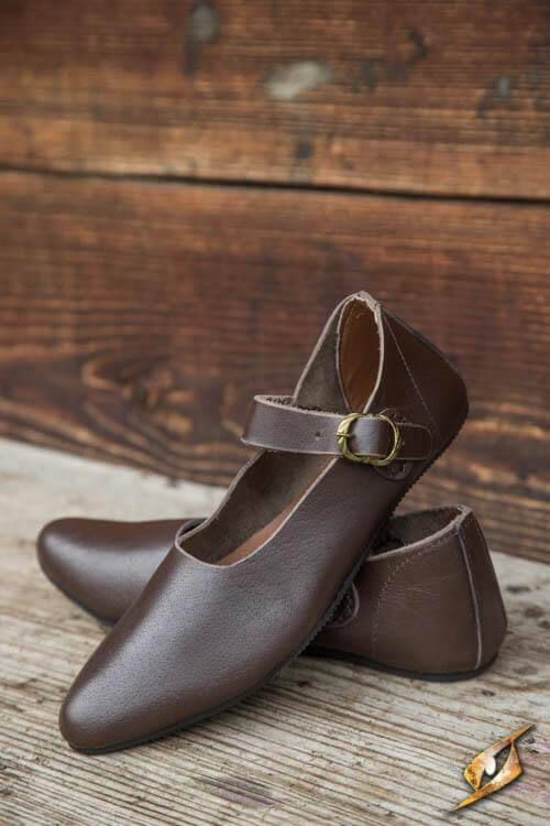 Shoes Astrid handmade brown leather shoes with ankle strap on rustic background.