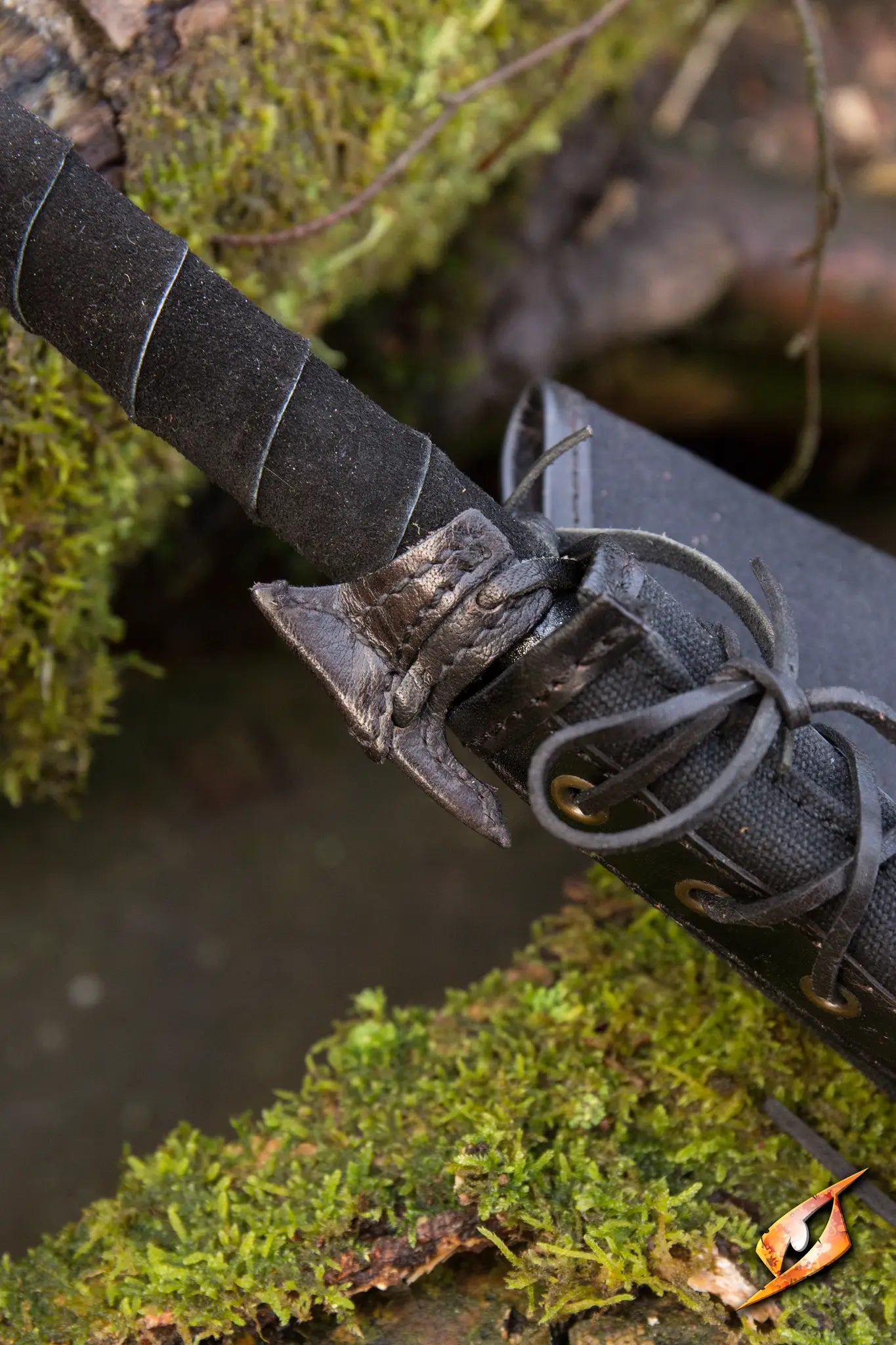 Elven Holster Hook showcasing the secure design, holding a sword in an ancient forest setting.