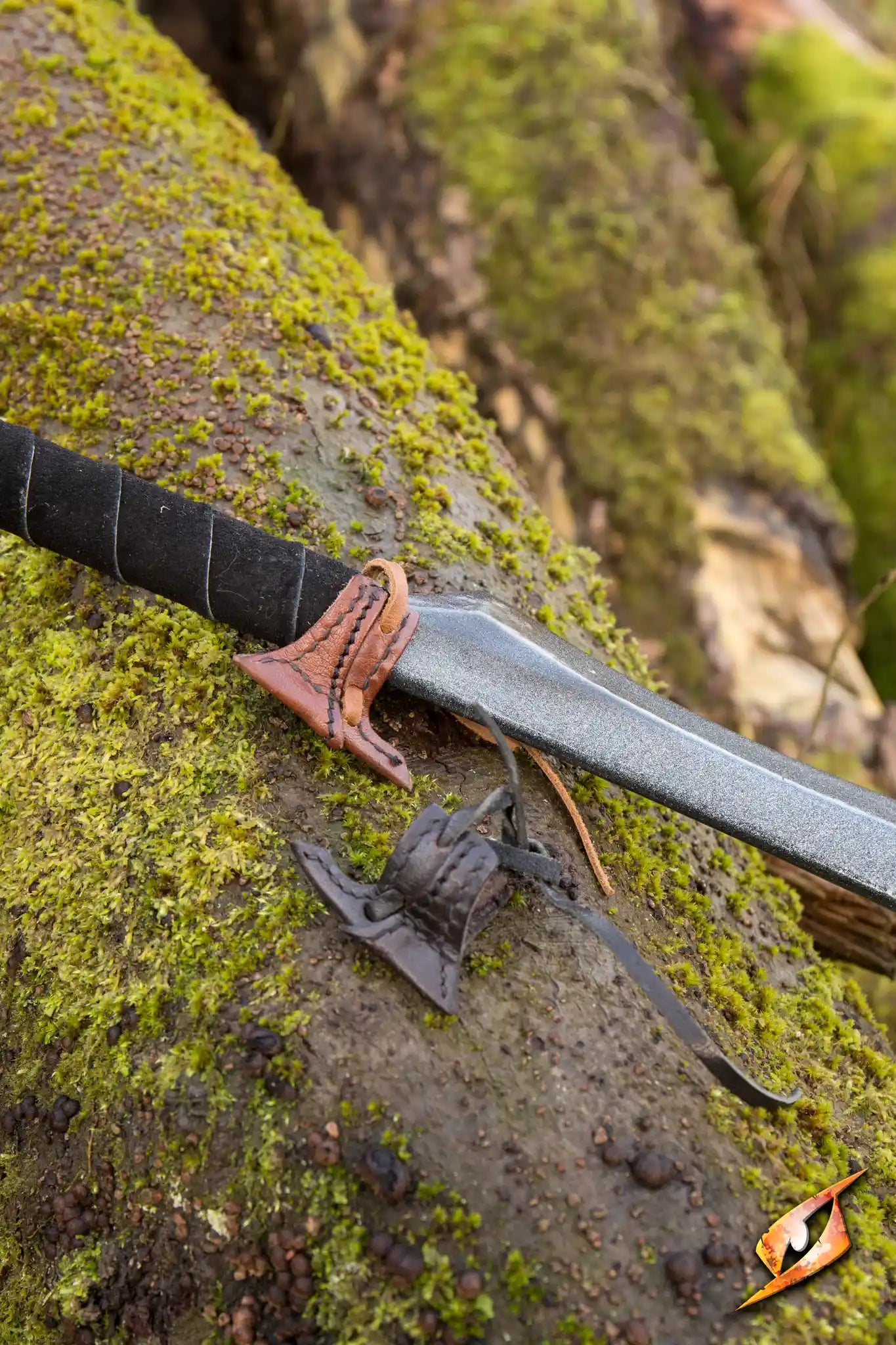 Elven Holster Hook showcasing a sword resting on mossy terrain, highlighting its secure design for adventurers.