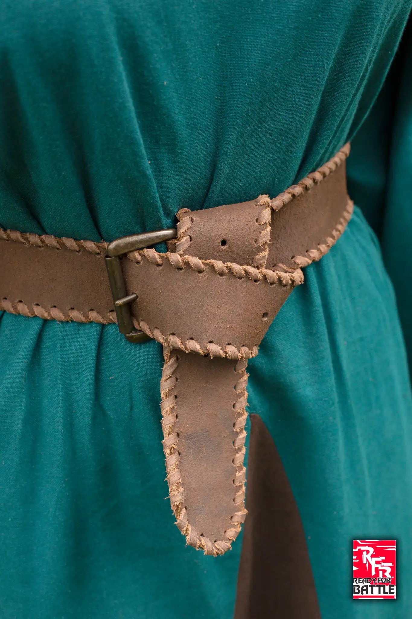 RFB Laced Belt secured around a green garment with decorative stitching and a metal buckle.