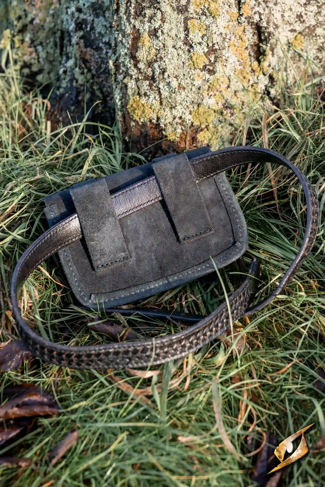 Warrior bag - Suede - Large displayed on grass near a tree, perfect for storing coins and small items.