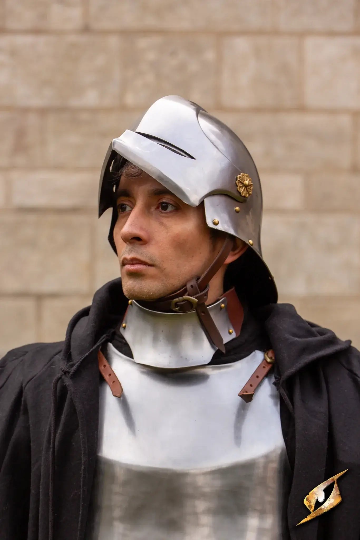 Man wearing a Renegade Helmet and armor, showcasing medieval-inspired design and attention to detail.