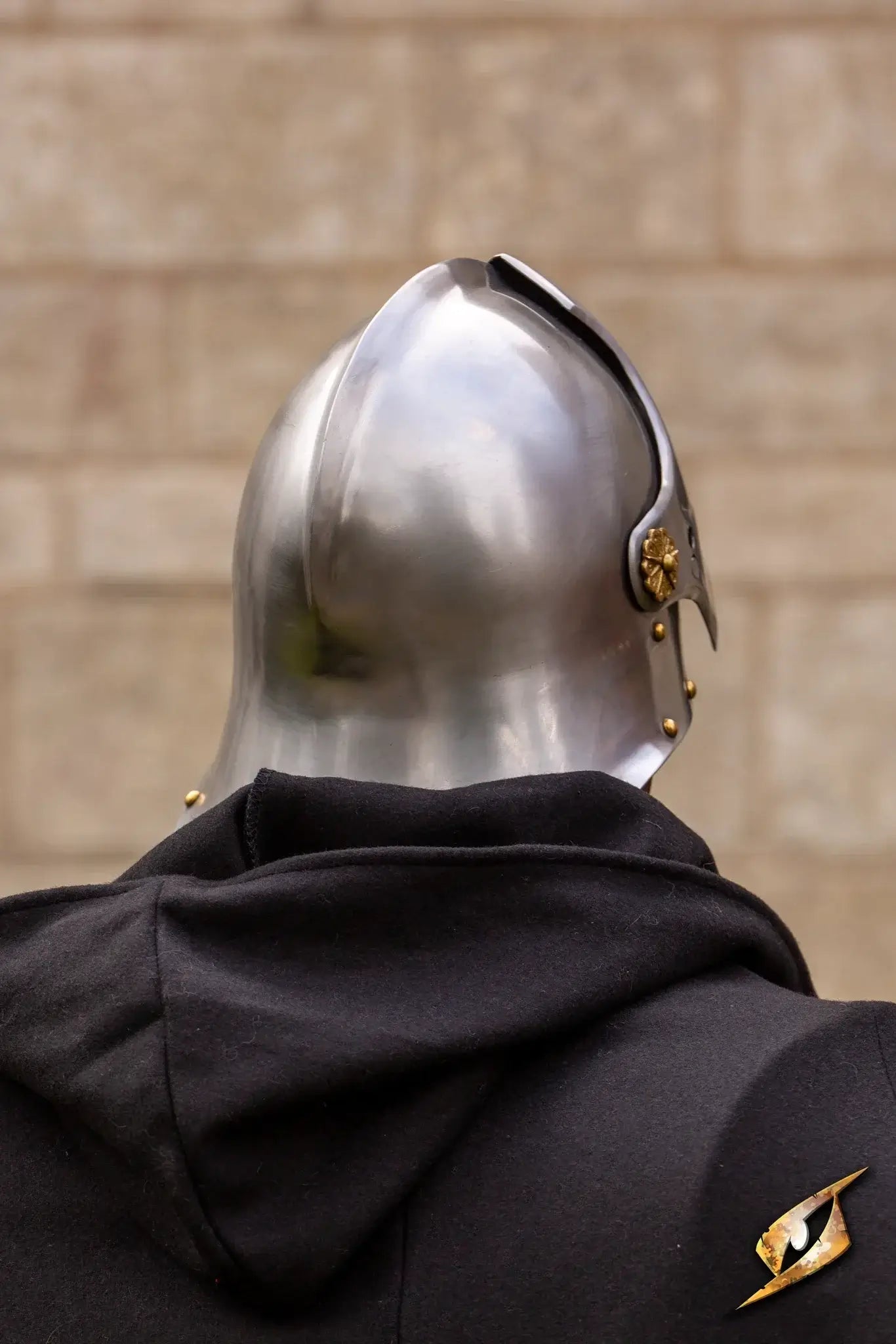 Renegade Helmet worn by a soldier, showing a metallic design with a casual hoodie in the background.