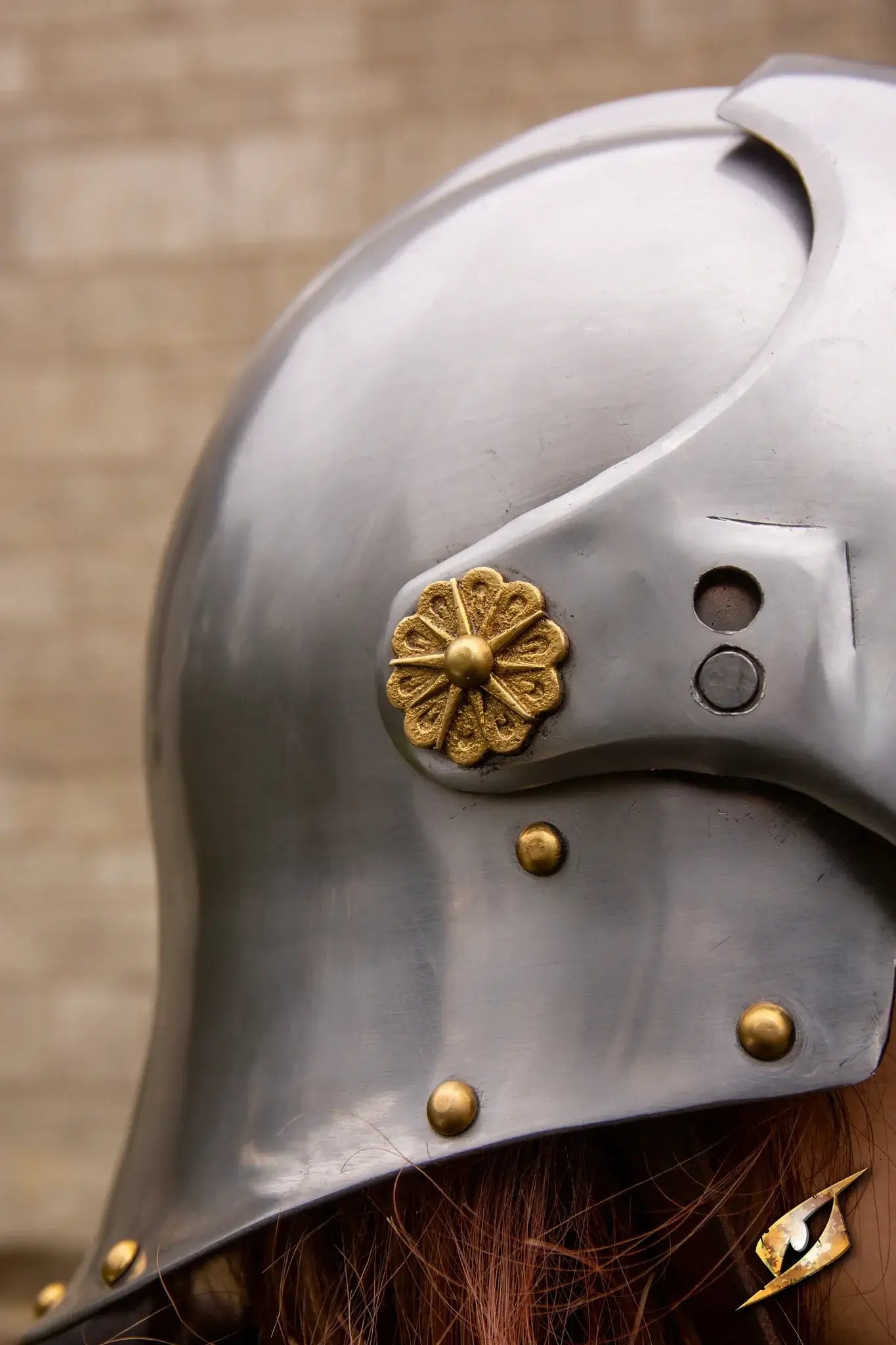Close-up of the Renegade Helmet with detailed brass embellishments and metallic finish.