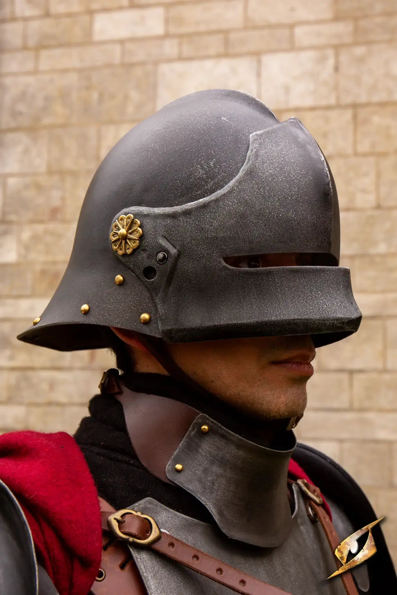 Close-up of a soldier wearing a traditional Renegade Helmet with ornate details, showcasing protective gear.