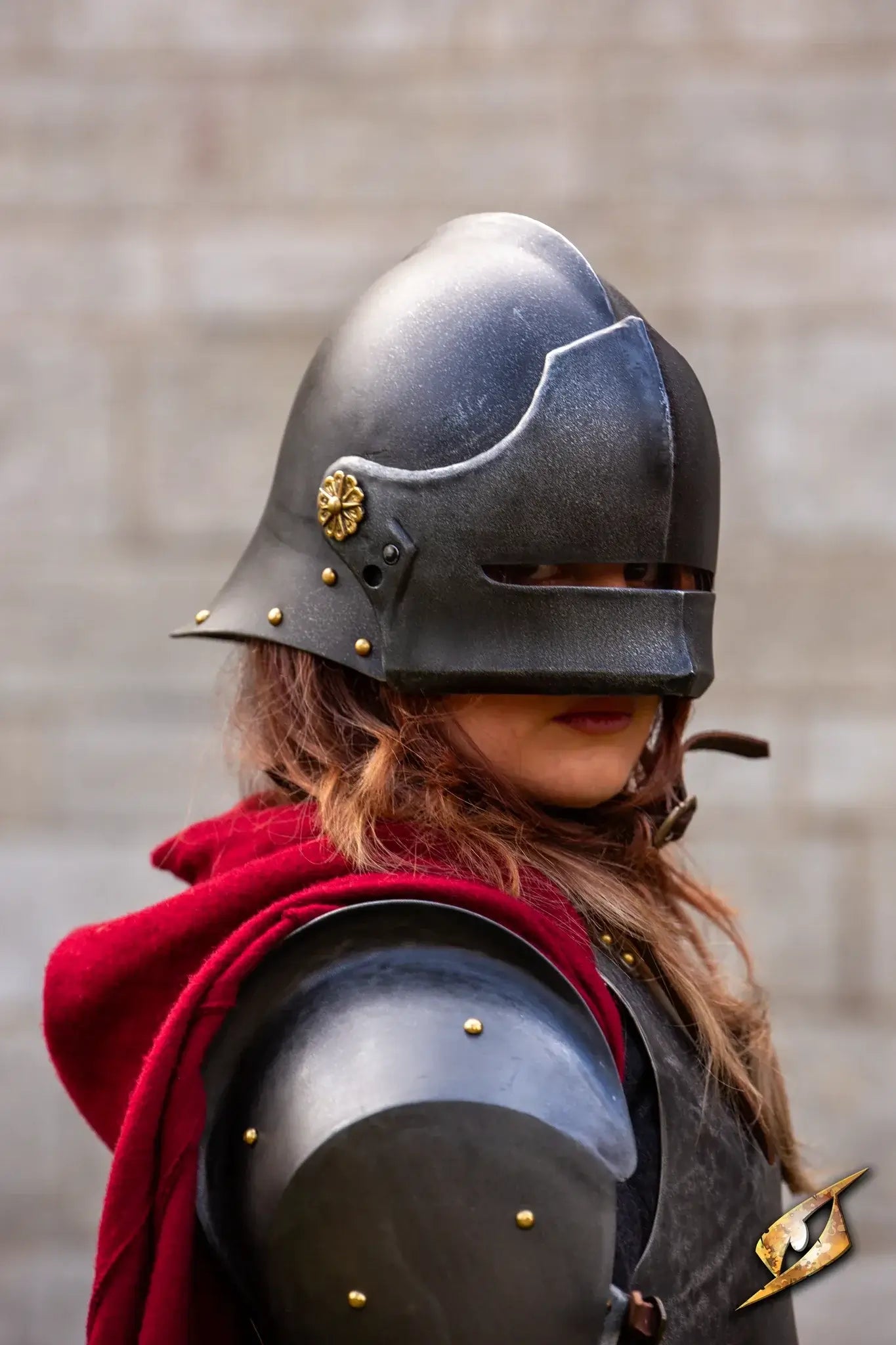 Renegade Helmet worn by a soldier, showcasing a sleek design and protective features in a medieval setting.
