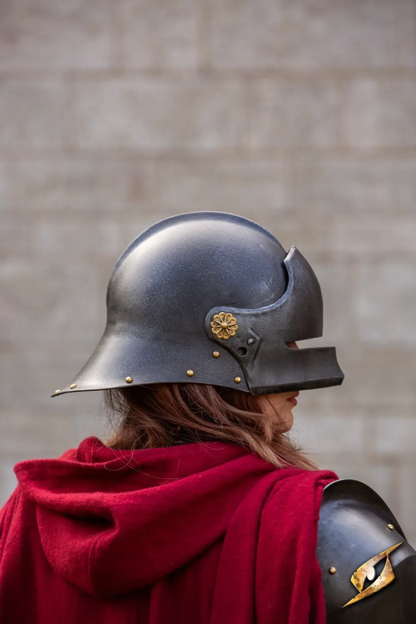 A soldier wearing a Renegade Helmet with a red cloak, showcasing its detailed design.