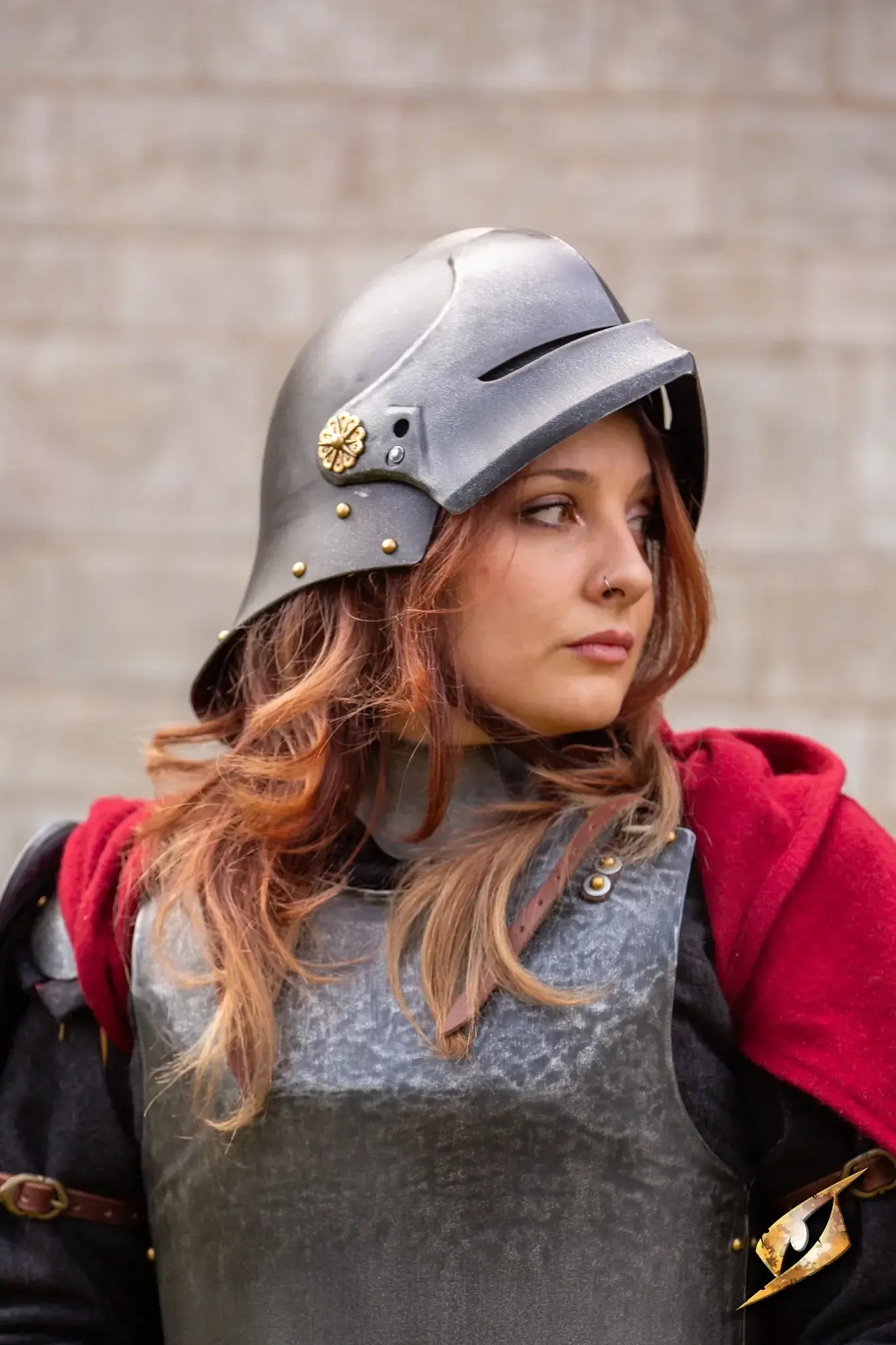 Woman wearing a Renegade Helmet with armor, showcasing historical combat attire.