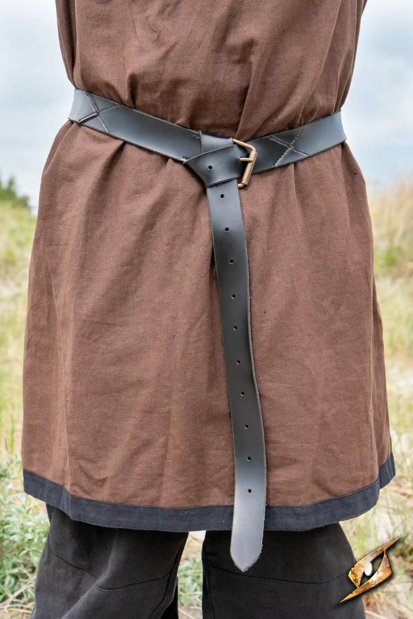 X Belt - Faux Leather worn by a warrior, showcasing its sturdy design and secure buckle in a natural setting.