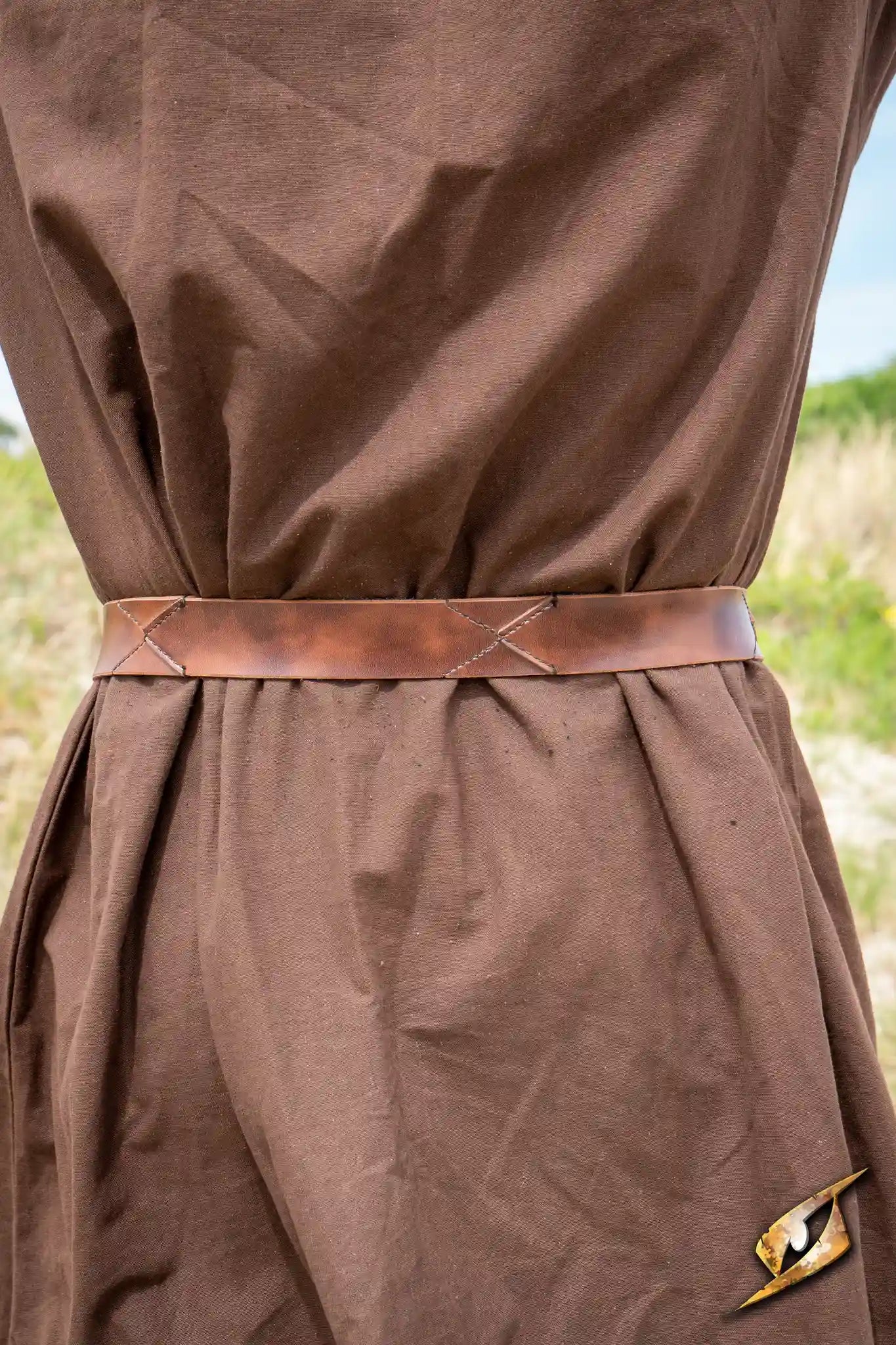 X Belt - Faux Leather worn with a brown costume, showcasing its stylish and rugged design.