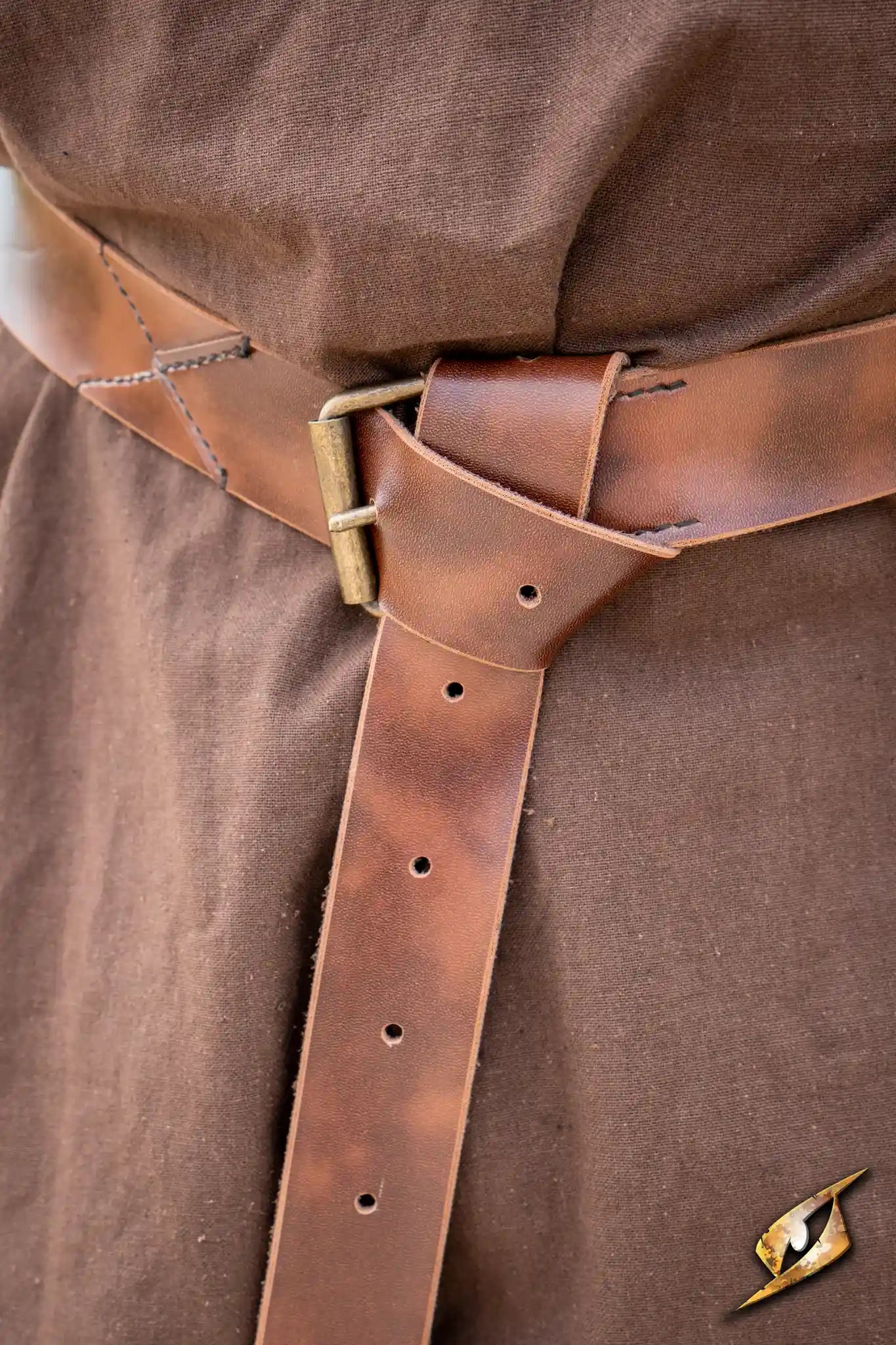 X Belt - Faux Leather secured around a brown garment, showcasing detailed leather craftsmanship.