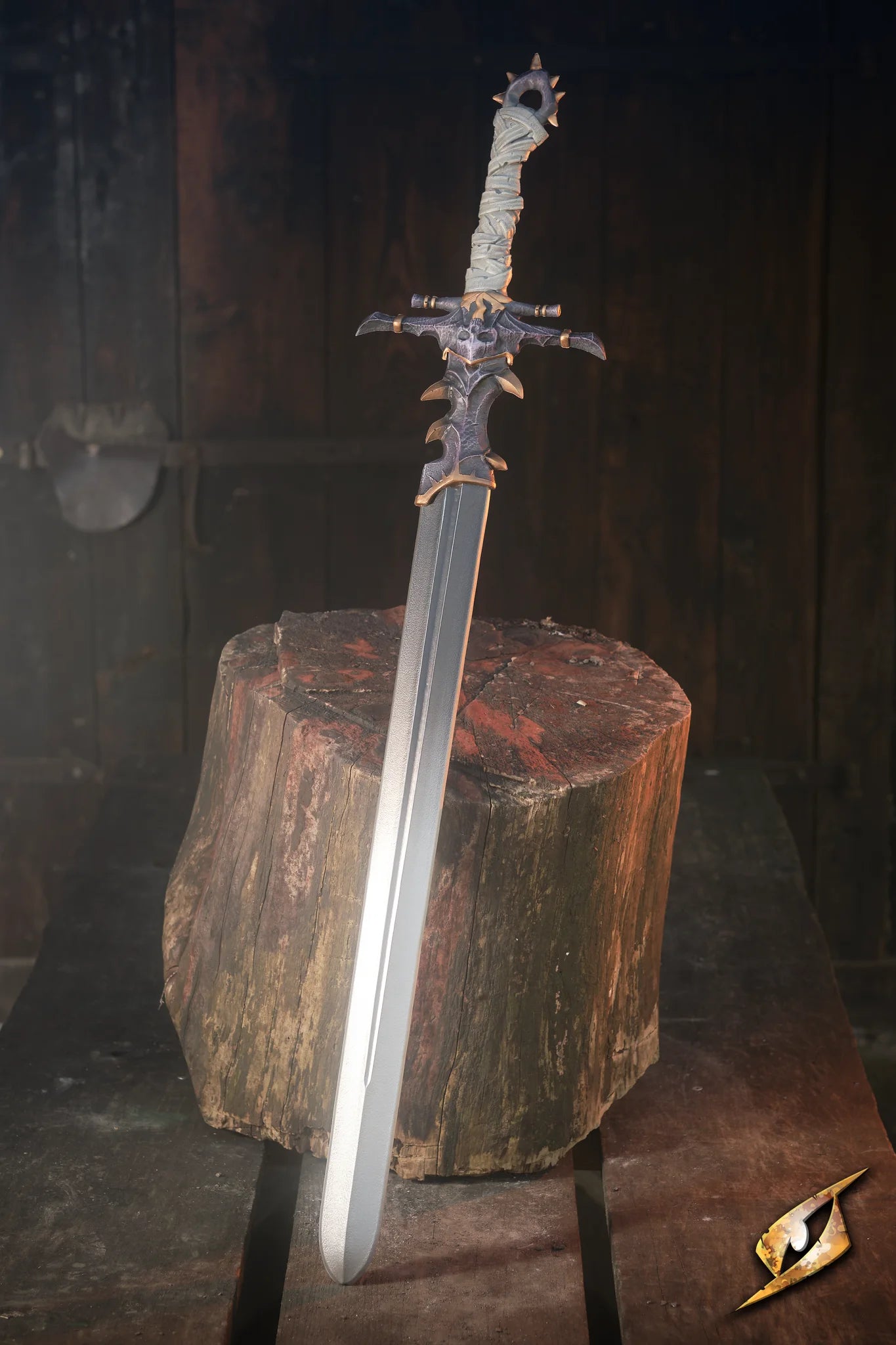 Marauder Sword displayed on a wooden stump, showcasing its intricate design and strong construction.