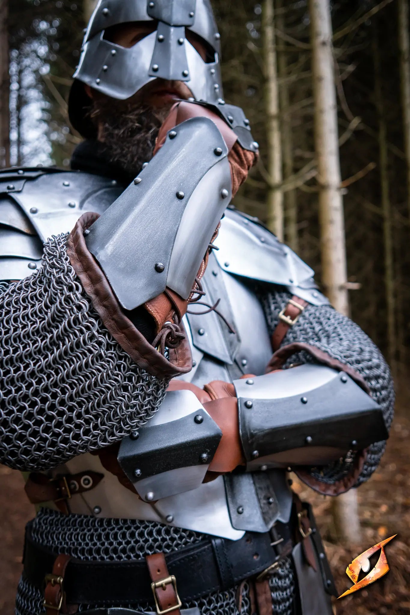 Dreki Armguards worn by a warrior in chainmail and armor, showcasing robust steel protection and Nordic design.
