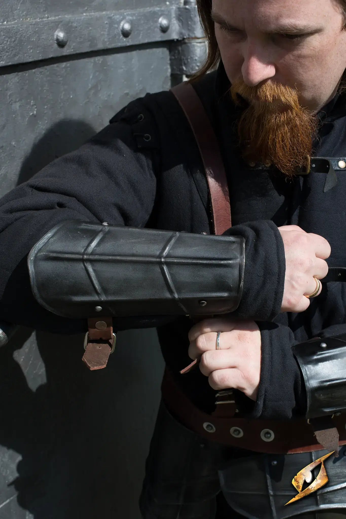 Detailed view of a user adjusting the Dark Drake Complete Armour while preparing for battle.