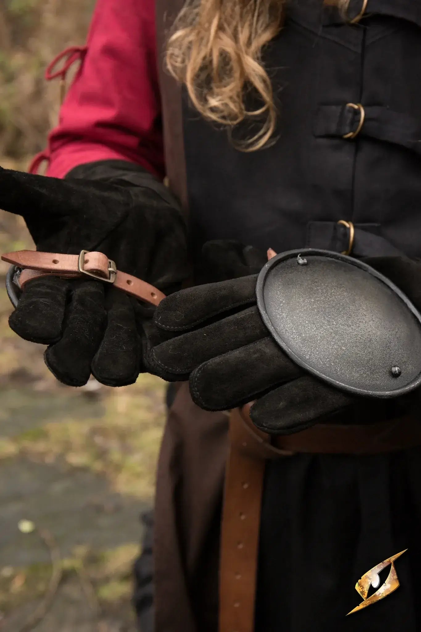 Rondel Hand Protection worn by a fencer holding protective gear, showcasing safety in swordplay.