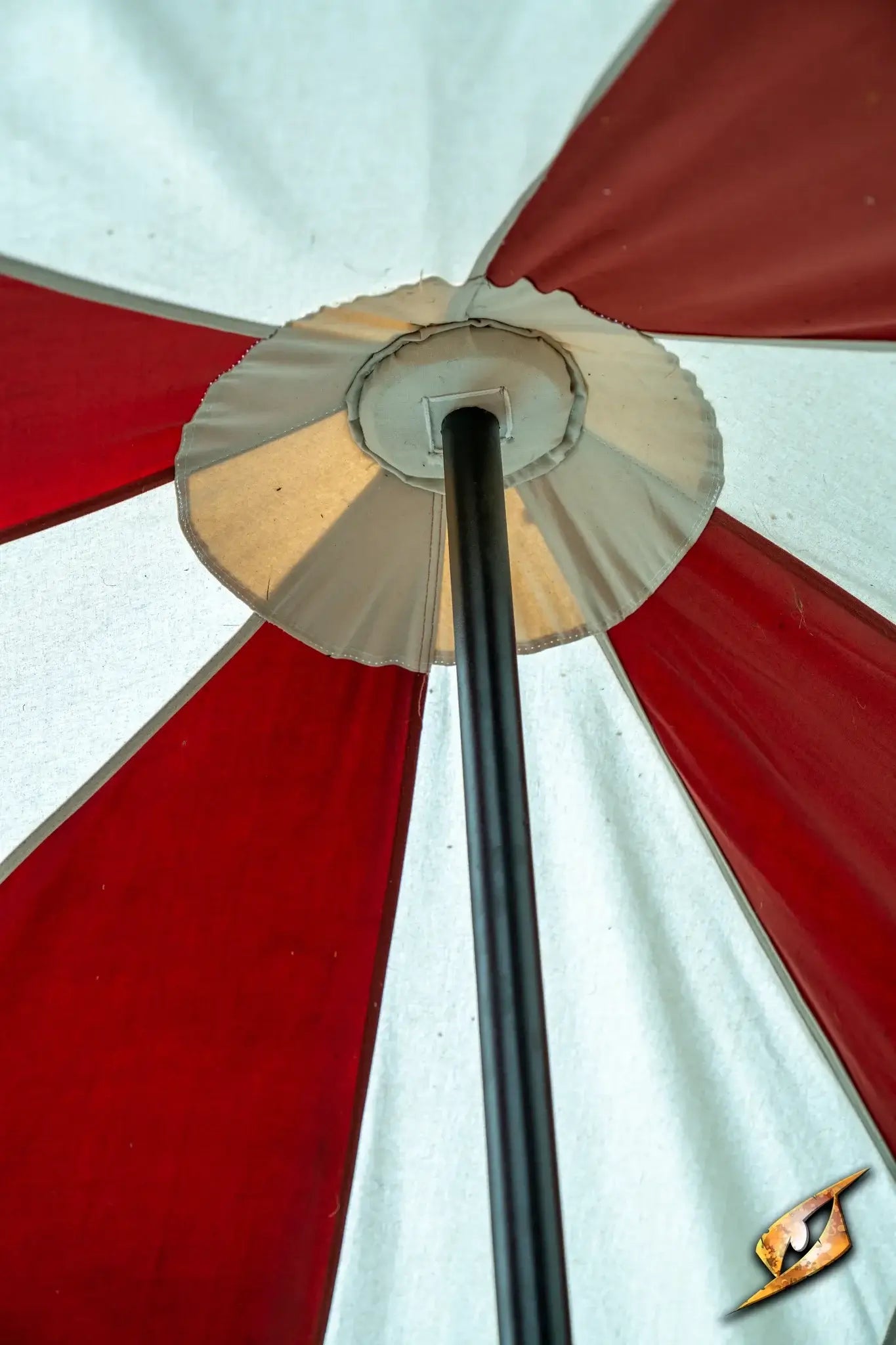 View from below of a Marquee Tent - 4x4m with red and white fabric and central pole.