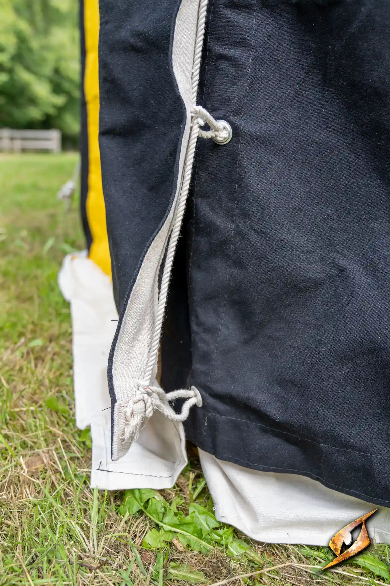 Marquee Tent - 4x4m close-up of fabric fastenings and tent flaps on a grassy area.