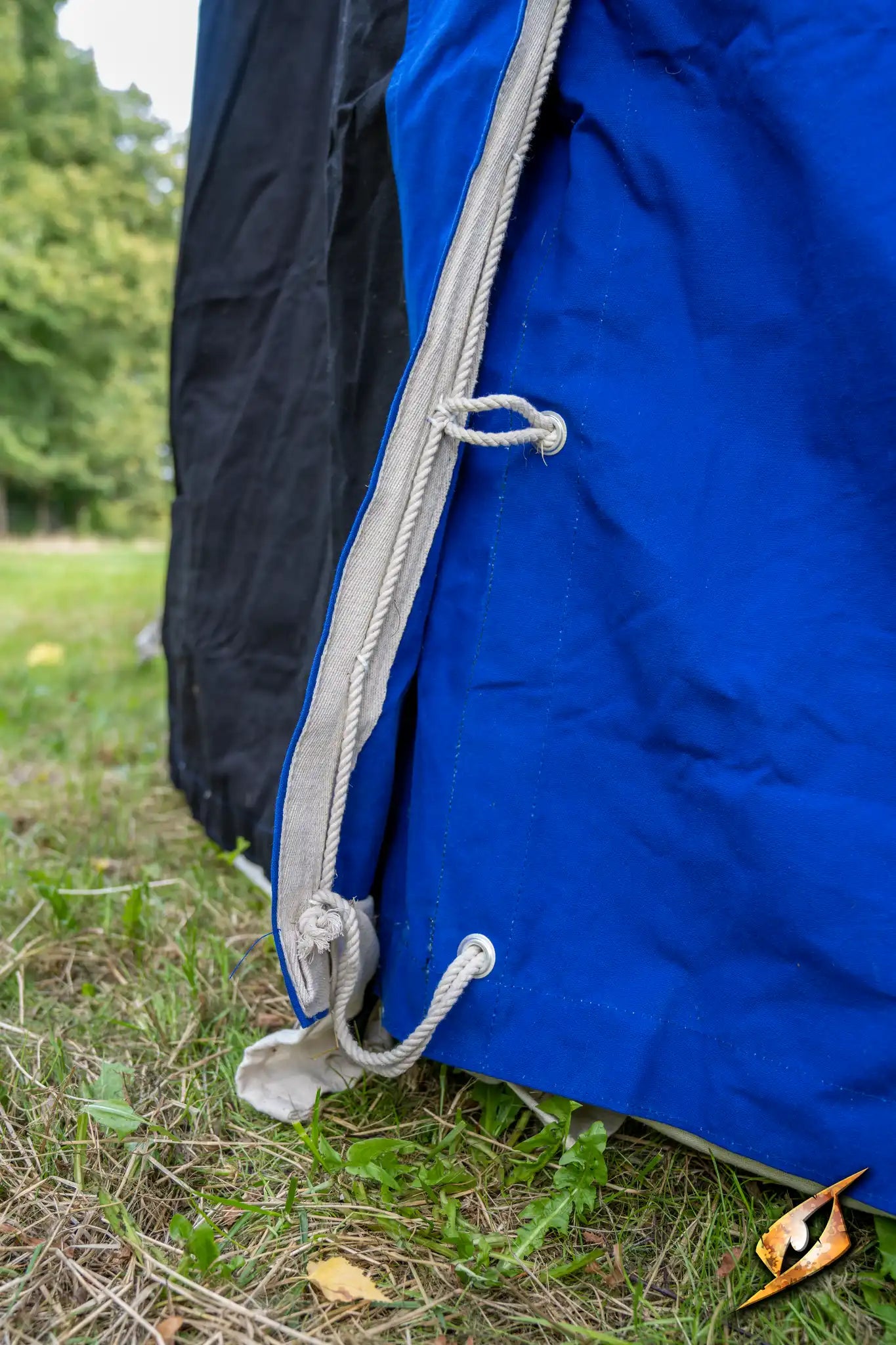 Close-up of the blue fabric and cords of the Marquee Tent - 4x4m highlighting its sturdy design.