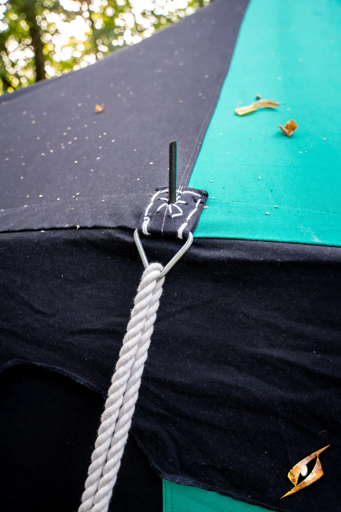 Close-up of Marquee Tent - 4x4m showing tent flap attachment and rope securing points.