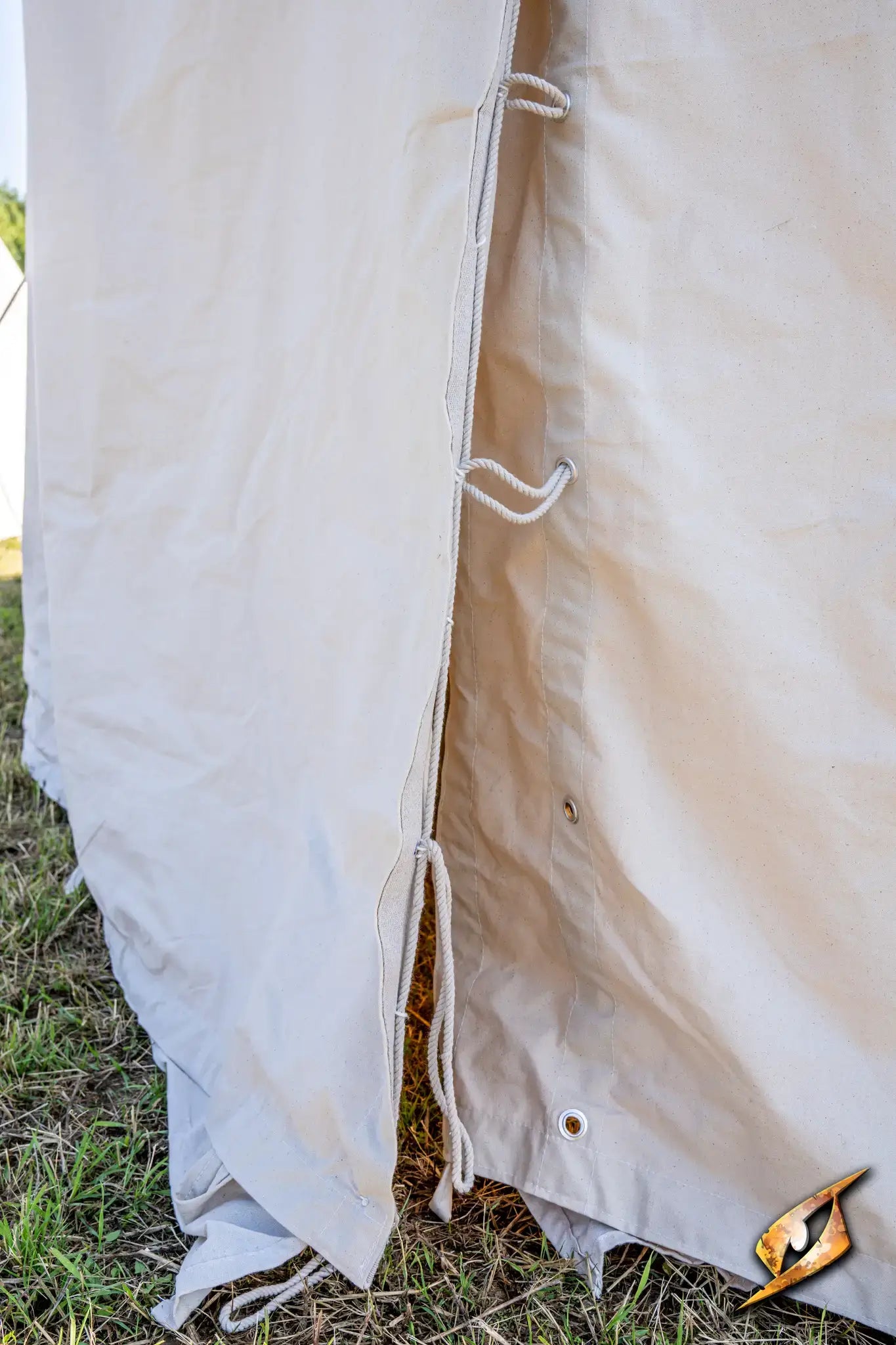 Close-up of the side of a Marquee Tent - 4x6m showing fabric and tie details.