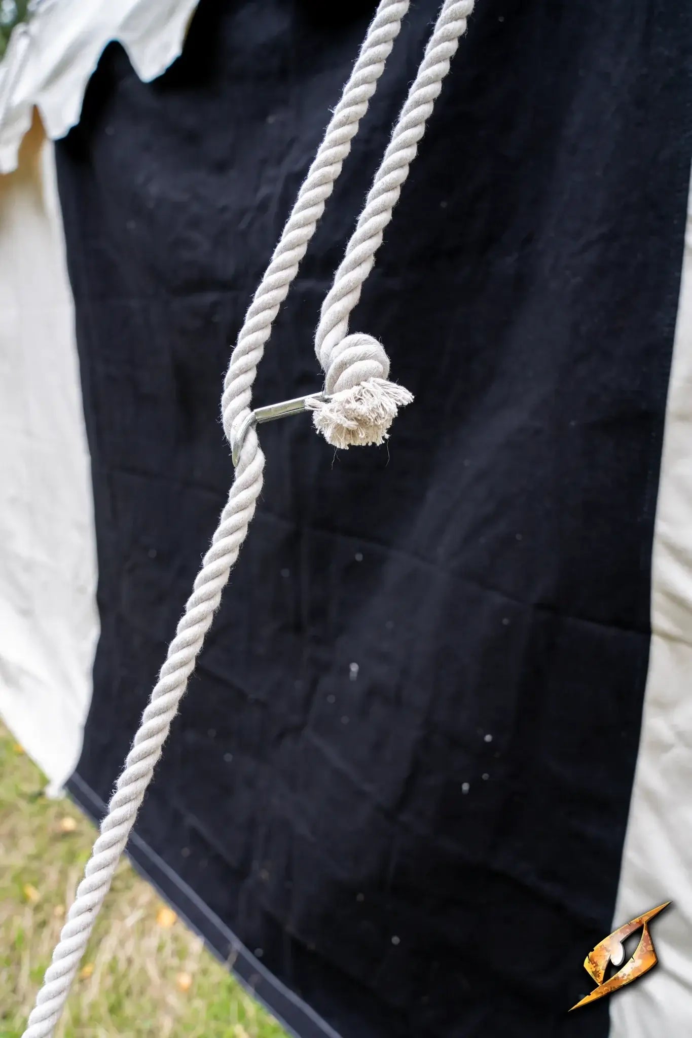 Close-up of rope tied to a Marquee Tent - 4x6m, showcasing secure fastening and durable fabric.