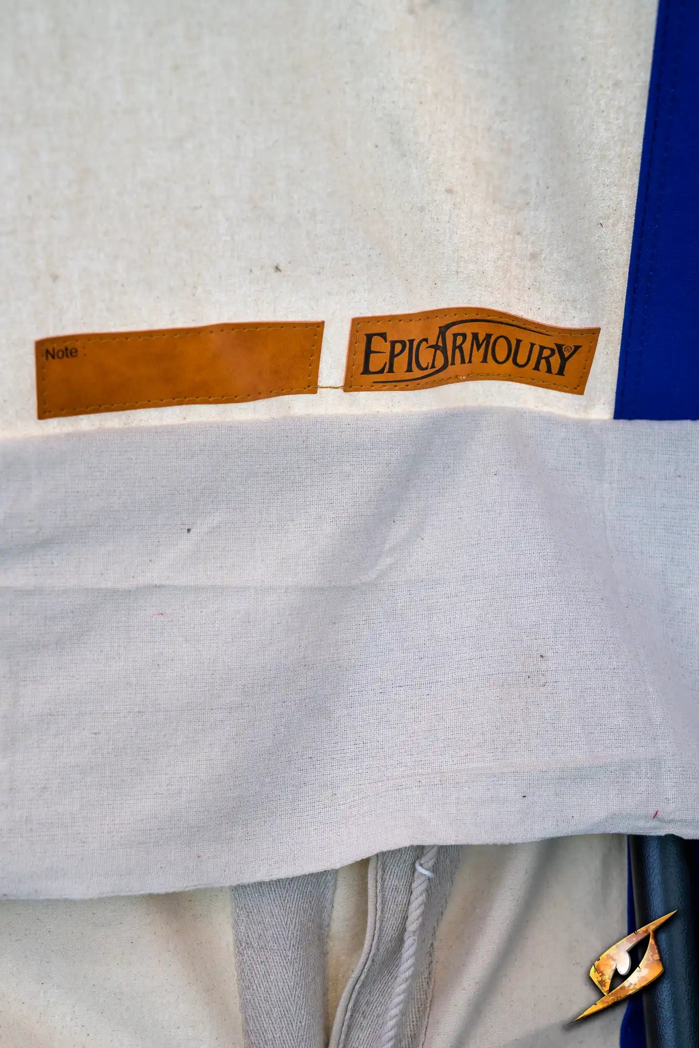 Close-up image of Epic Armory label on a marquee tent fabric detailing.