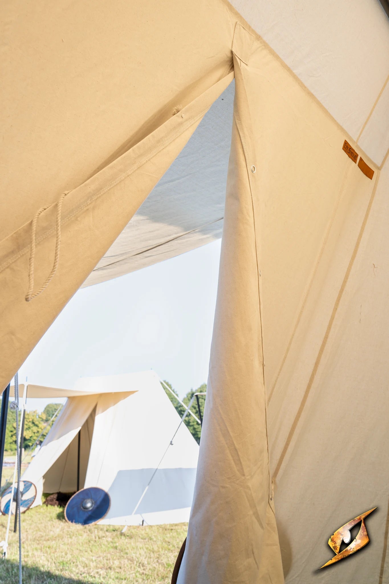 View inside the Double Wedge Tent - 3x5 m, showcasing the entrance and other tents in the background.