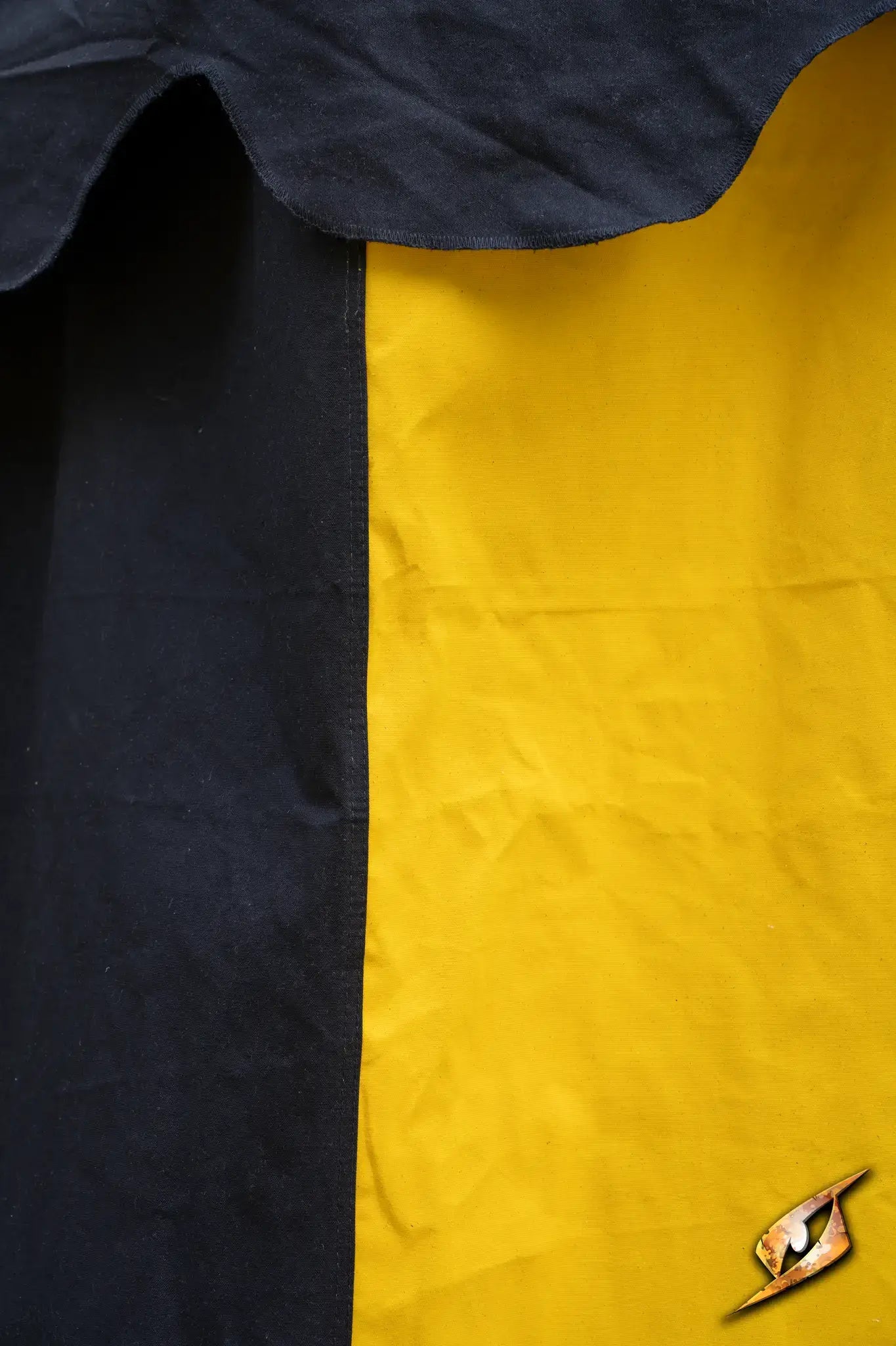 Close-up of a Round Pavilion Tent - 3m with black and yellow fabric panels.