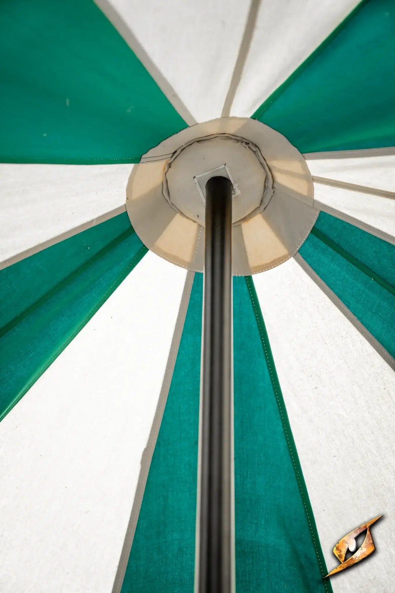 View from underneath the Round Pavilion Tent - 3m showcasing its colorful fabric and central pole.