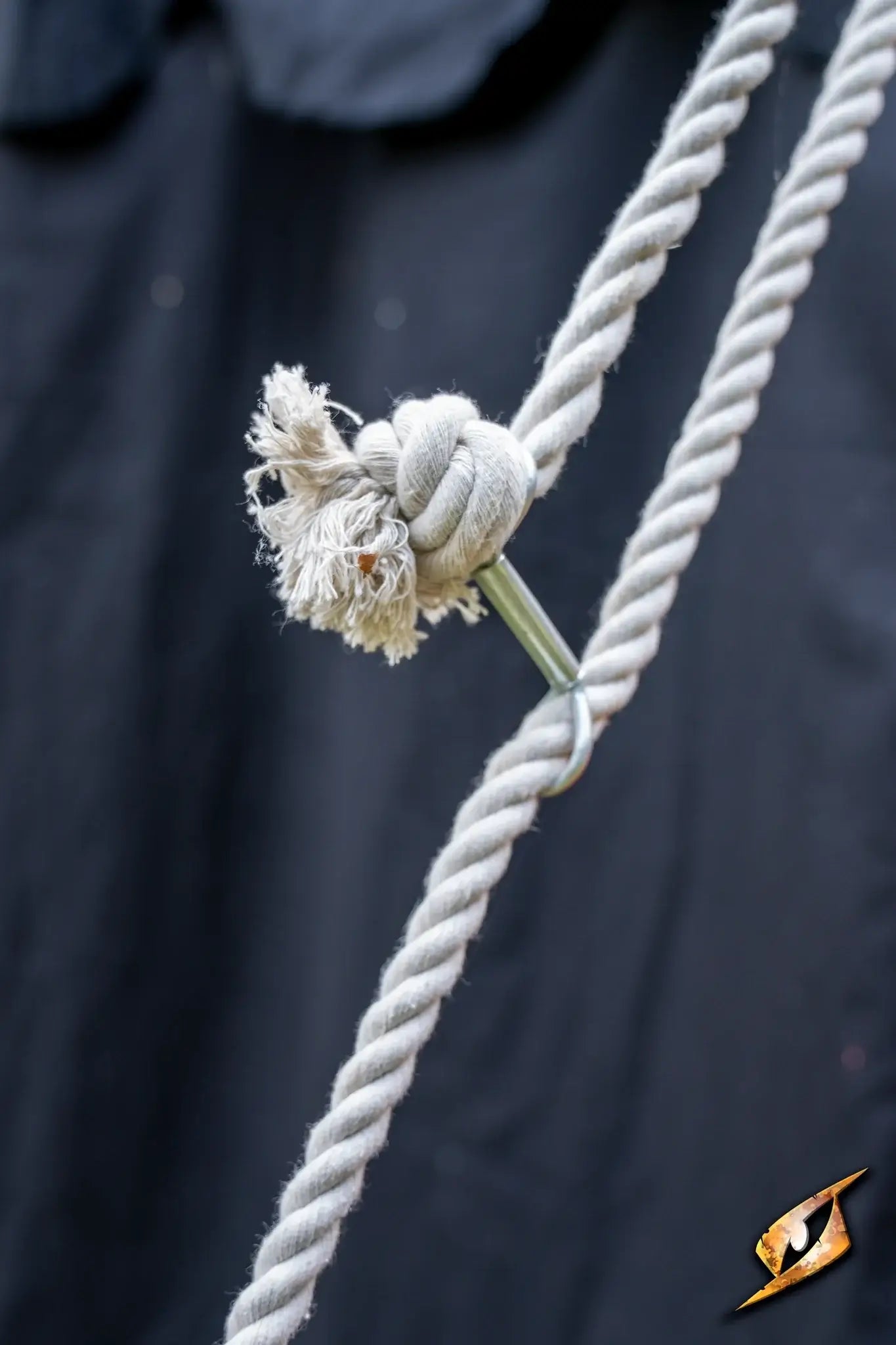 Close-up of a knot on a rope used in a Round Pavilion Tent - 3m setup with a black background.