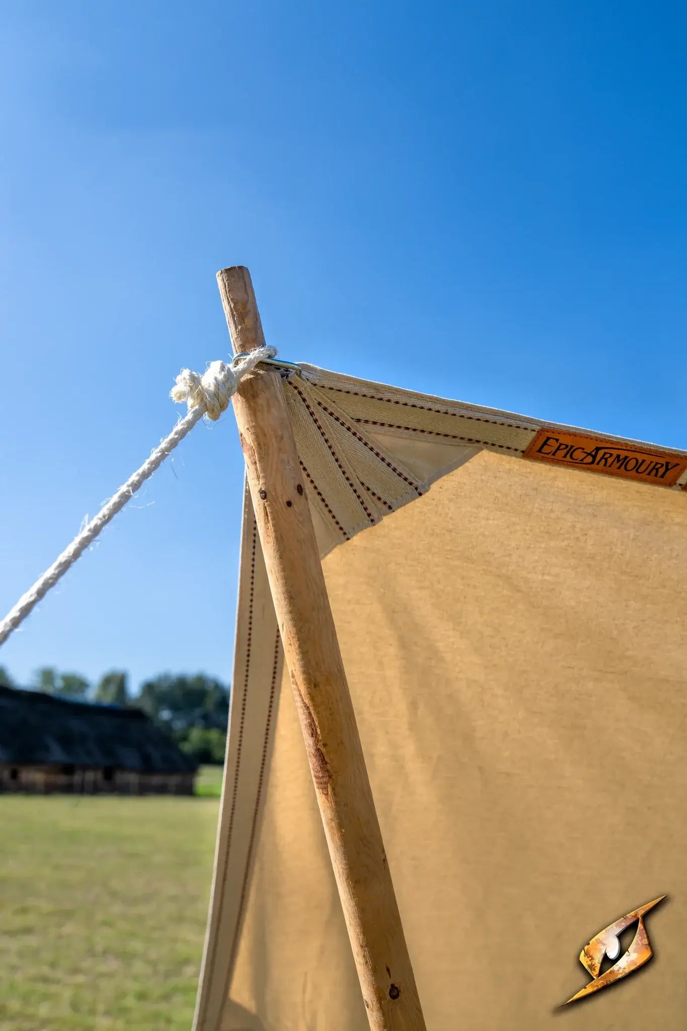 Epic Armoury Tarpaulin displayed on a sunny day, showcasing its sturdy design and durable fabric.