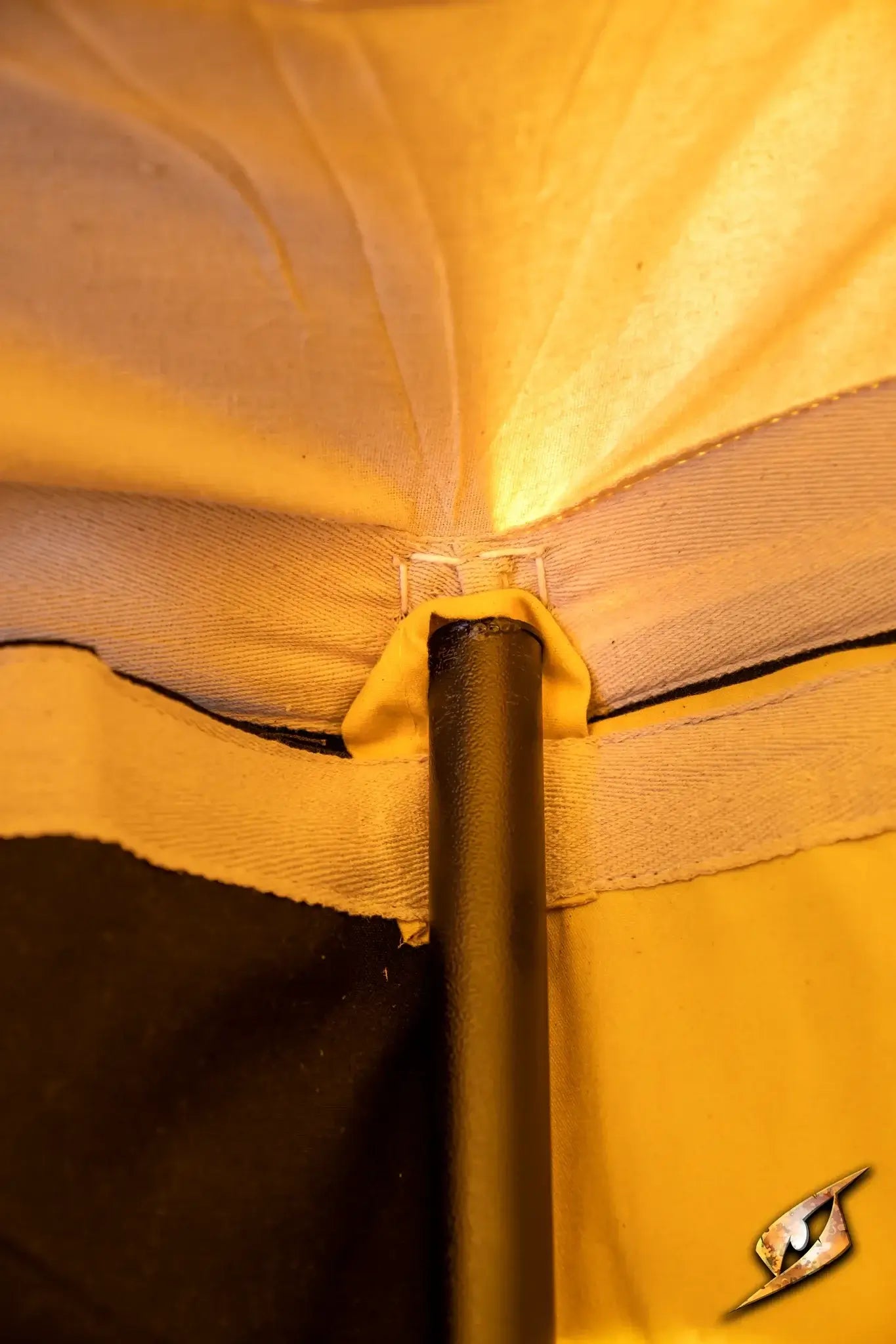 Inside view of a Marquee Tent - Sides - 5x8m showing the support pole and fabric connection.