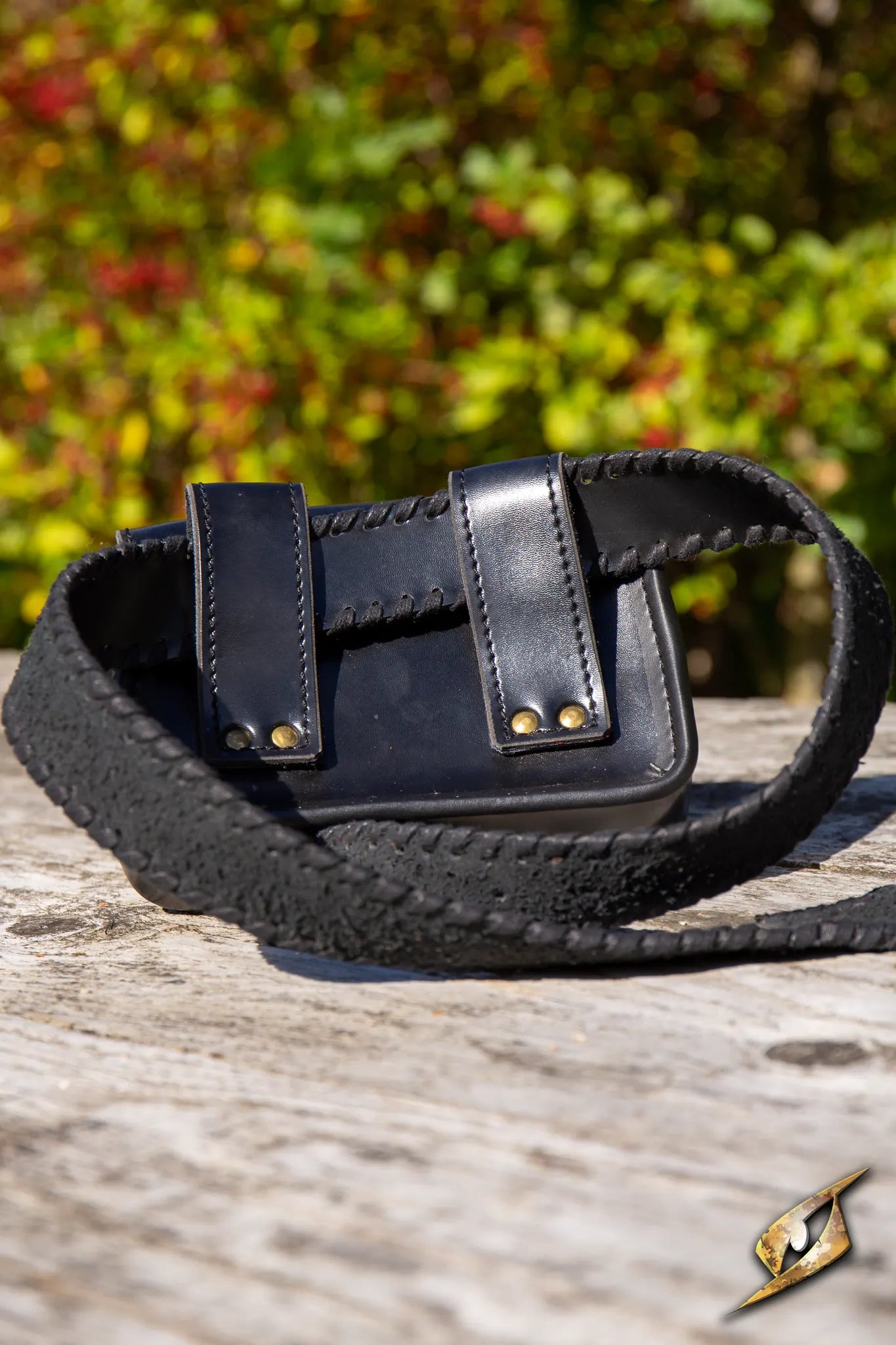 Warrior Bag - Faux Leather - Large displayed on a wooden surface with a scenic background.